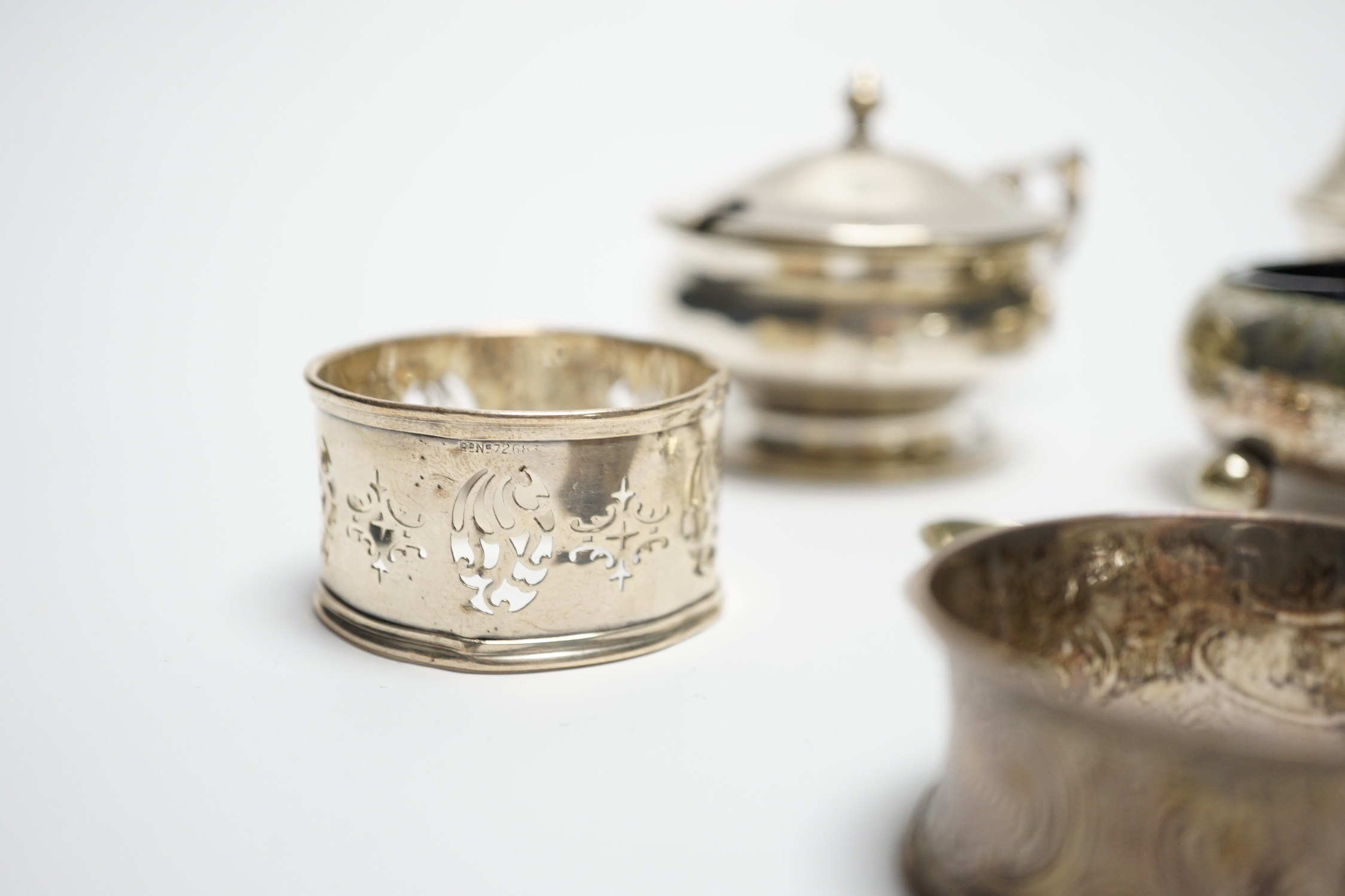 Six assorted silver cruets and three silver napkin rings.